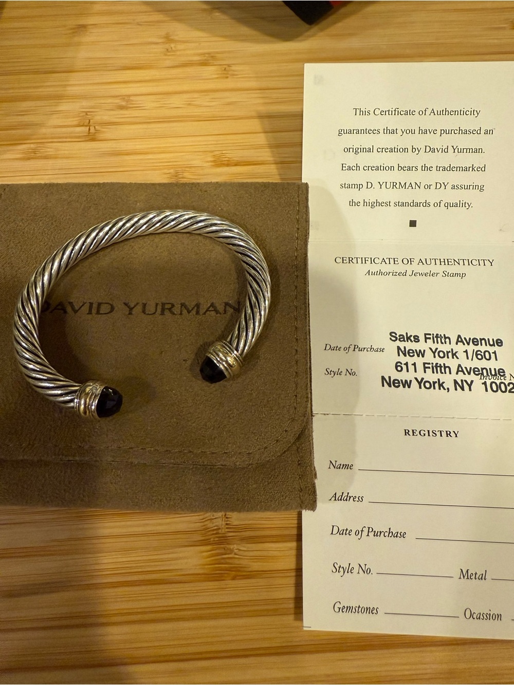 authentic David Yurman Cable Bracelet with ,b Onyx  14 K tips size medium 7MM